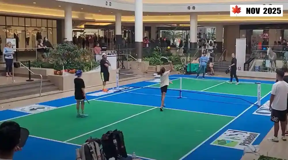 Players competing on indoor pickleball courts during the 2025 season in Canada, showcasing vibrant all-season play.