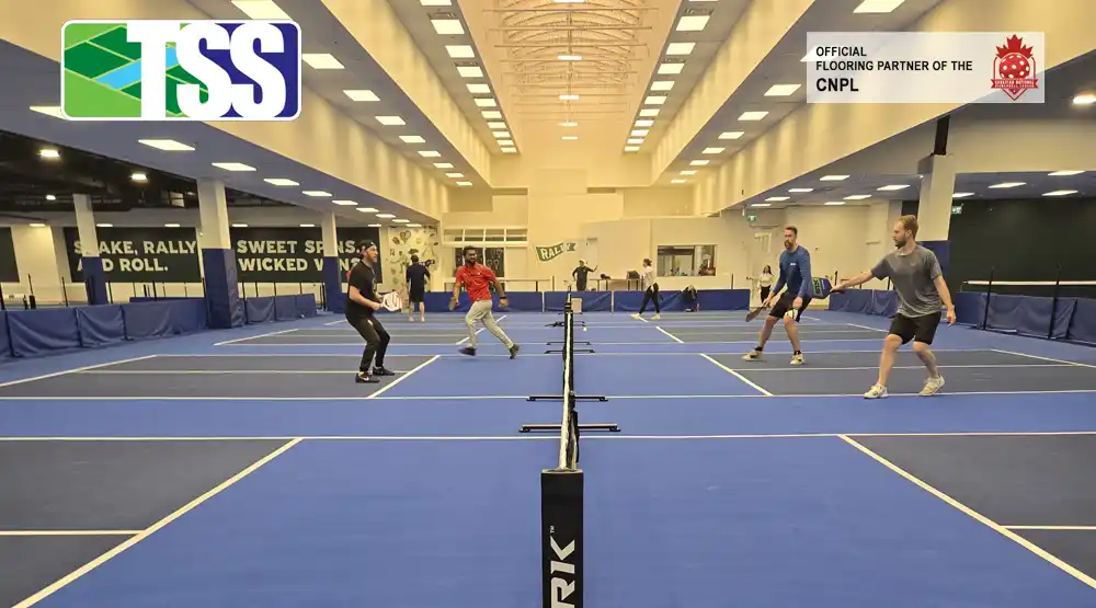 Players competing on TSS Pickleball indoor courts branded as the Official Court Flooring Partner of the Canadian National Pickleball League