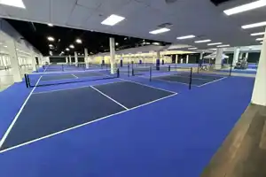 Wide-angle view of Rally at Sherwood indoor pickleball facility, Etobicoke, featuring premium competition-grade courts by TSS Pickleball.