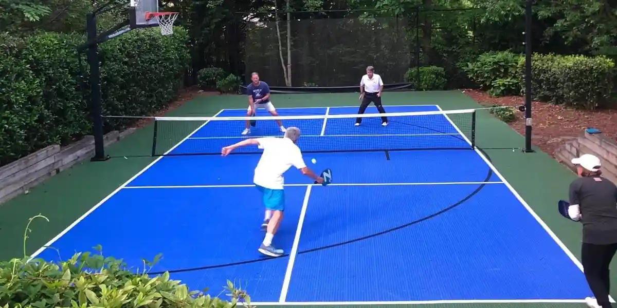 Family playing Pickleball on their backyard multi-court